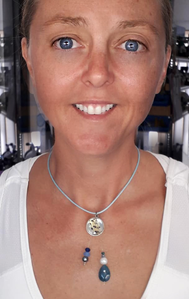 Diver models a lionfish fin necklace available at scuba tech diving centre